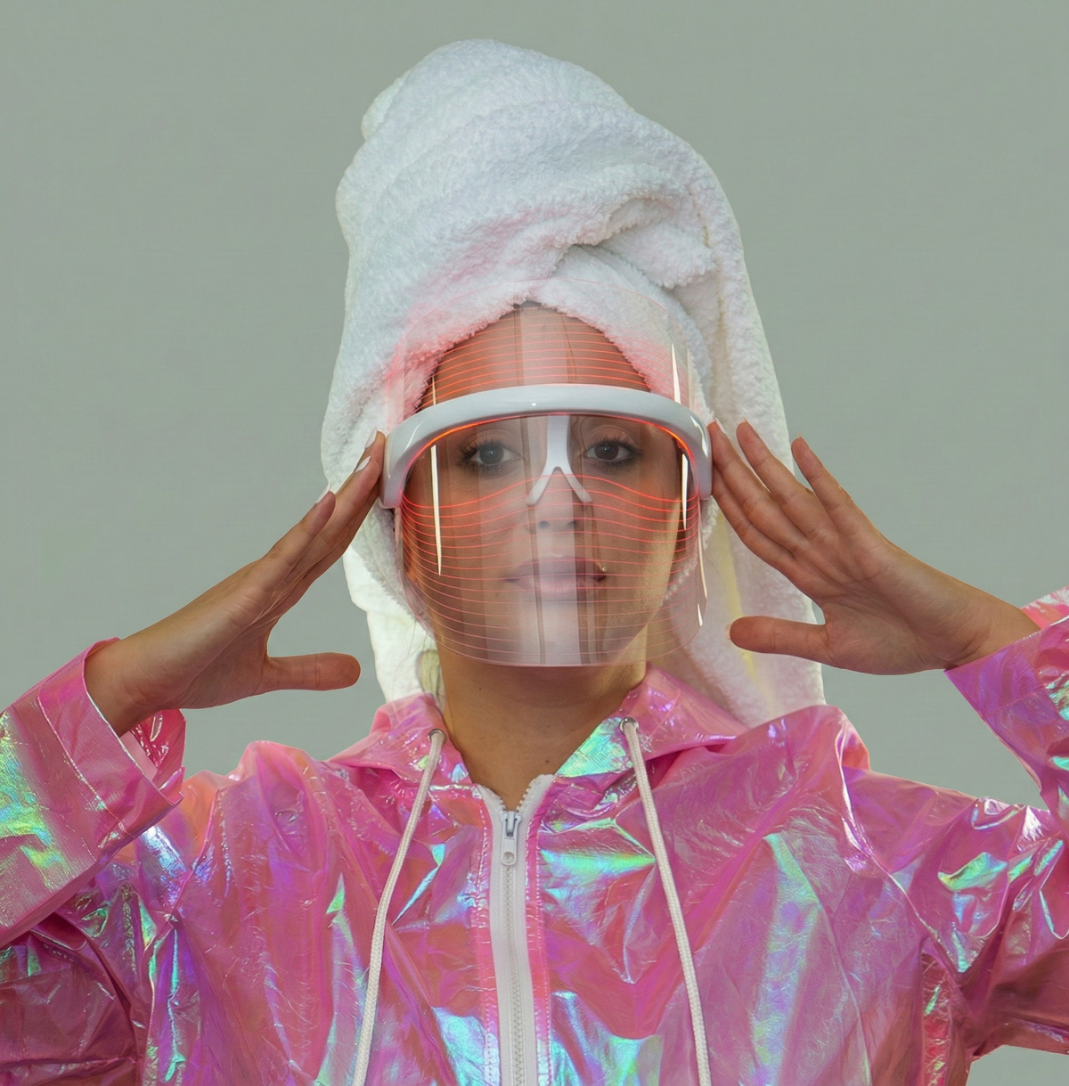 Woman wearing BIODASH LED light therapy mask for acne and anti-aging skincare treatment